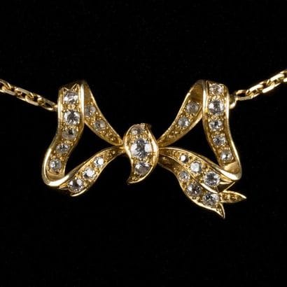 Chaine pendentif noeud or et diamants taille...