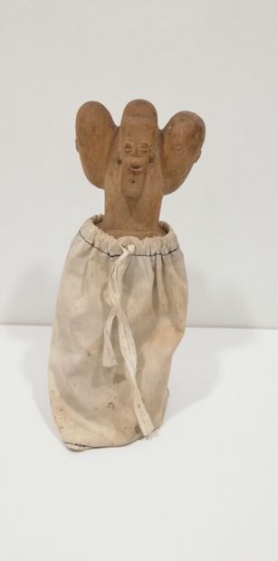 FON-BENIN 

Four-headed character, one of...