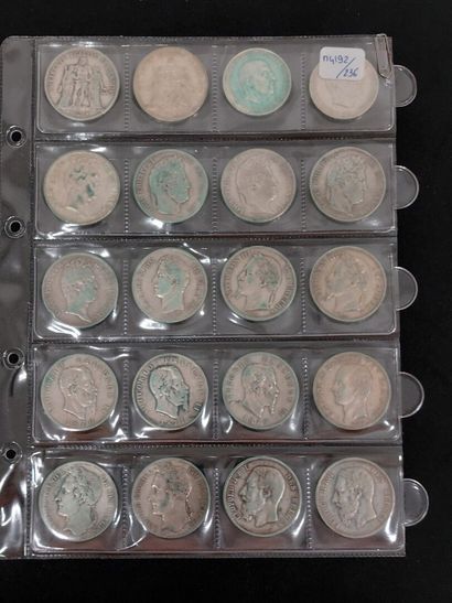 A sheet with 20 silver coins, modules and...