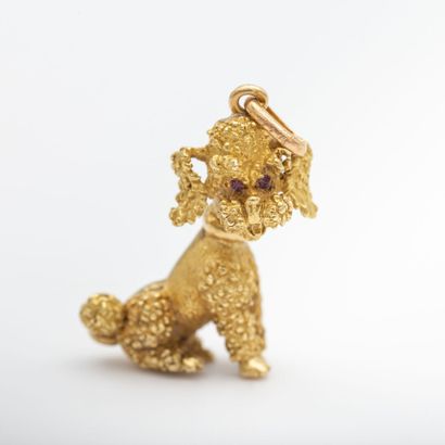 Gold textured poodle pendant with red stones...