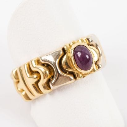 Ring ruby cabochon, setting articulated two...