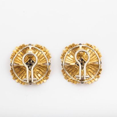 Pair of textured gold and sapphire flower...