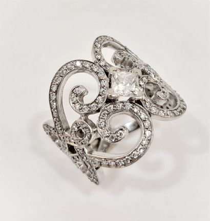 Scroll ring with central princess cut diamonds...