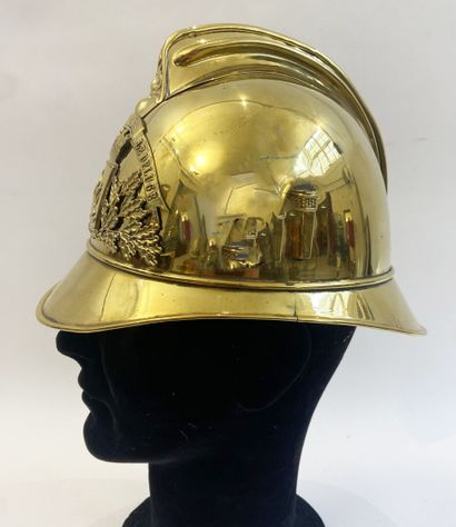 Lot of two brass fireman helmets, one with...