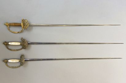 Lot of three swords of company : 
- a sword...