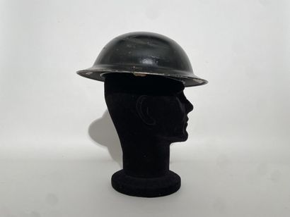 English Tin Hat painted in black with its...