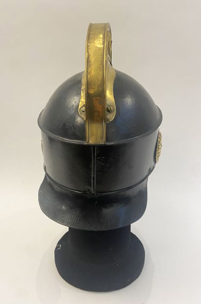 Fireman's crest helmet, blackened iron sheet...