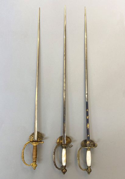 Lot of three swords of company : 
- a sword...