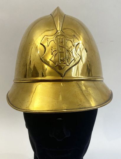 Lot of two brass fireman helmets, one with...