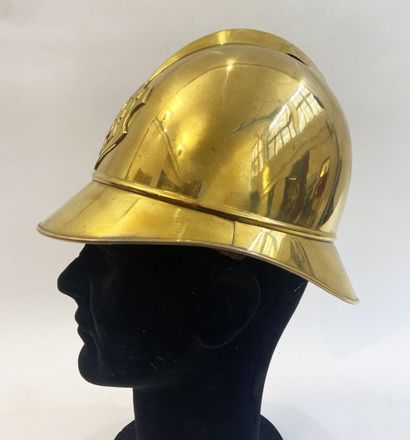 Lot of two brass fireman helmets, one with...