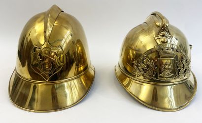 Lot of two brass fireman helmets, one with...