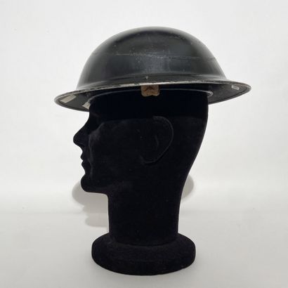 English Tin Hat painted in black with its...