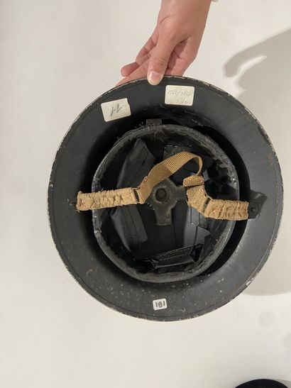 English Tin Hat painted in black with its...