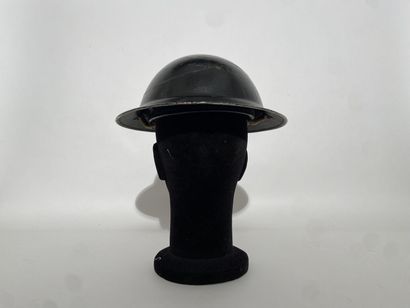 English Tin Hat painted in black with its...