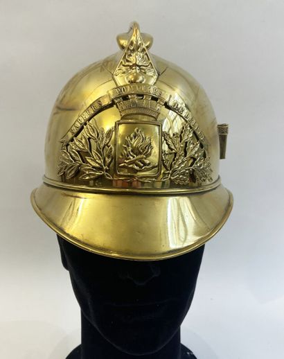 Lot of two brass fireman helmets, one with...