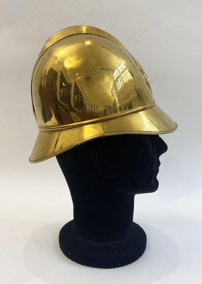 Lot of two brass fireman helmets, one with...