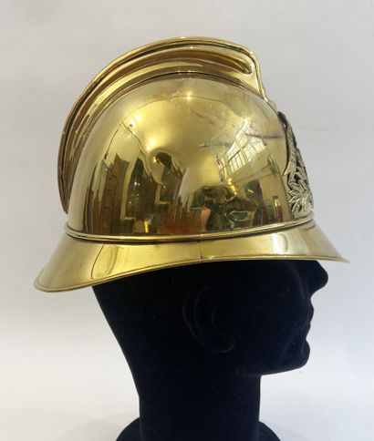 Lot of two brass fireman helmets, one with...