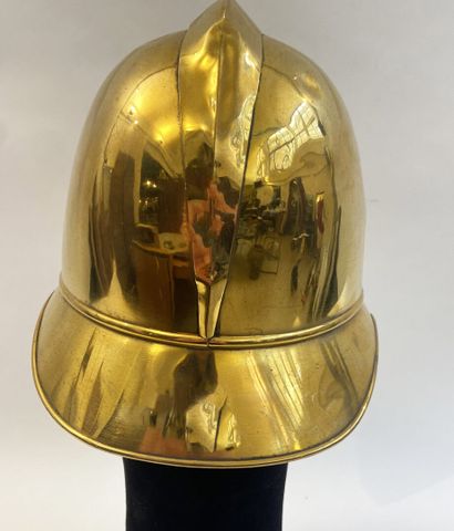 Lot of two brass fireman helmets, one with...