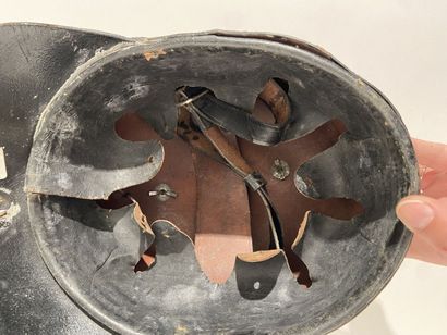 Leather helmet of fireman of a German city...