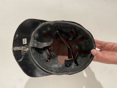 Leather helmet of fireman of a German city...