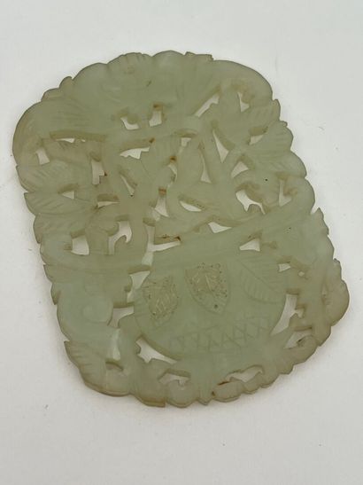 Deux pendentifs en jade céladon ajouré, l'un...