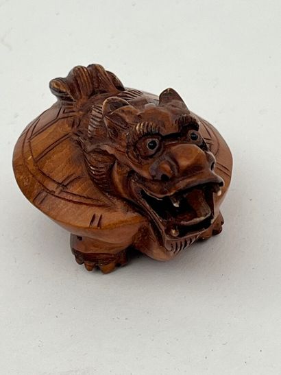 Petite statuette en bui représentant un dragon
Chine,...