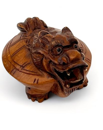 Petite statuette en bui représentant un dragon
Chine,...