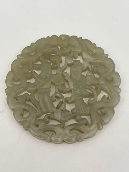 Deux pendentifs en jade céladon ajouré, l'un...