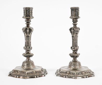 Pair of bronze candlesticks, richly decorated...