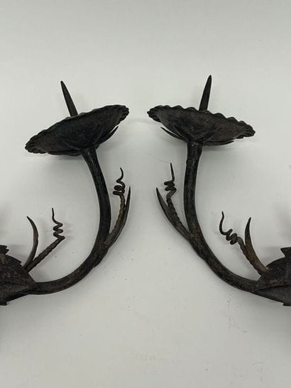 Pair of iron sconces with foliage motif.
L...