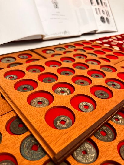 Lot of five trays of Annam coins and tokens
Two...