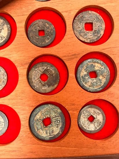 Lot of five trays of Annam coins and tokens
Two...