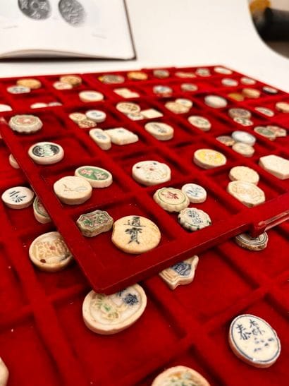 Lot of five trays of Annam coins and tokens
Two...
