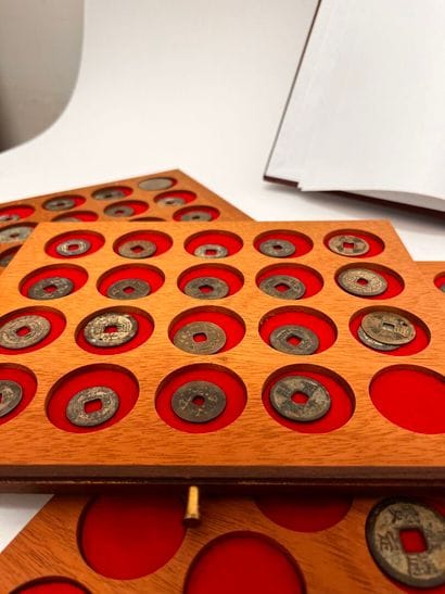 Lot of five trays of Annam coins and tokens
Two...