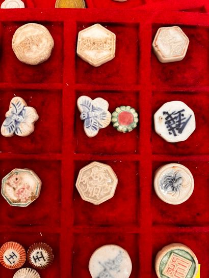 Lot of five trays of Annam coins and tokens
Two...