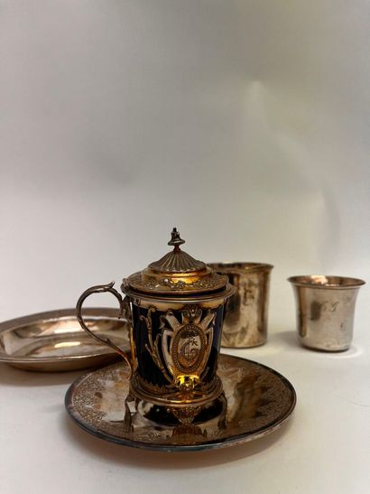 Silver set including: a coaster, a saucer,...
