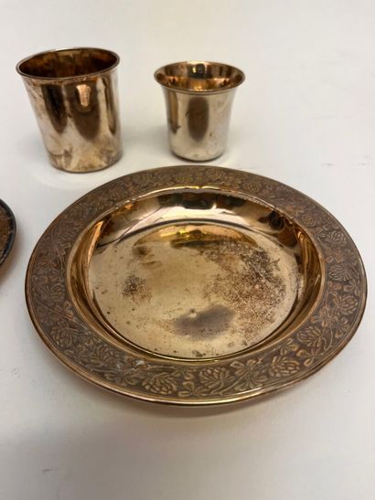 Silver set including: a coaster, a saucer,...