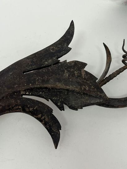 Pair of iron sconces with foliage motif.
L...