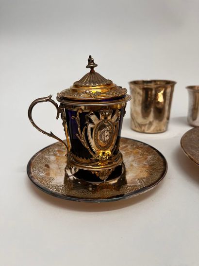 Silver set including: a coaster, a saucer,...