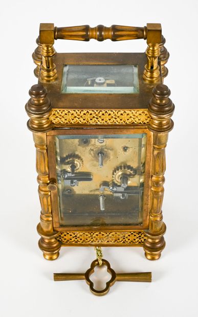 Officer's clock in chased brass, the uprights...