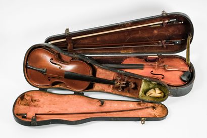 Set of two violins in their cases, and three...
