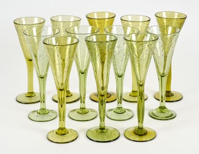 BIOT 
Suite of twelve olive green champagne...