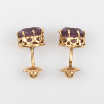 Pair of amethyst stud earrings set in 18K...