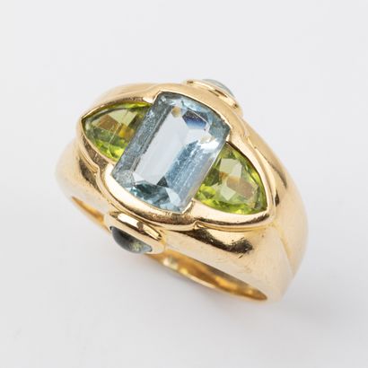Ring with topaz and peridots, set in 18K...