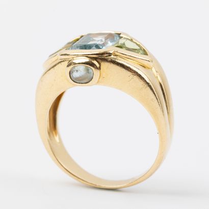 Ring with topaz and peridots, set in 18K...