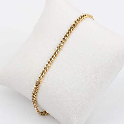 Chaine de cheville en or 18K , maille gourmette...