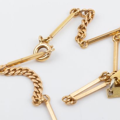 Collier en or 18K , maille semi- articulé...