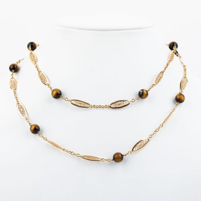 Sautoir in 18 K filigree gold, punctuated...