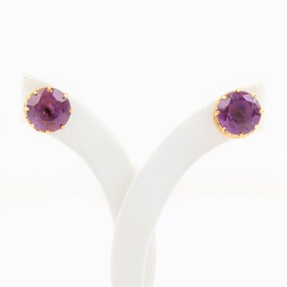 Pair of amethyst stud earrings set in 18K...