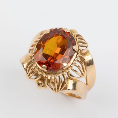 Orange stone cocktail ring set in 18K gold...